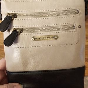 Stone mountain crossbody. Small damage on the back